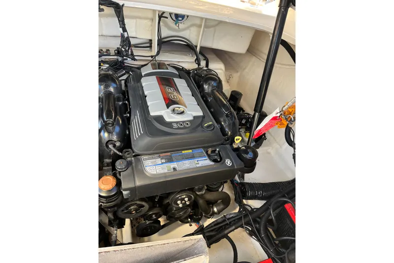 Slide: The Image of Engine compartment of a 2020 Sea Ray SLX 310 boat, featuring a Mercury 6.2L engine. - 35