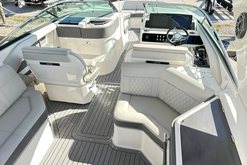 Slide: The Image of Luxurious 2020 Sea Ray SLX 310 boat interior with plush seating and modern dashboard. - 6