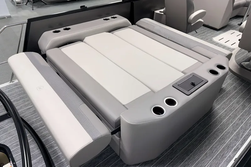 Slide: The Image of 2026 Premier 230 Sunsation RL Tritoon with luxurious seating and cup holders. - 11