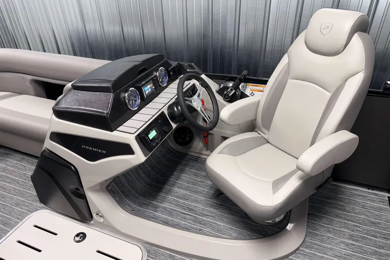 Slide: The Image of 2026 Premier 230 Sunsation RL Tritoon helm with modern dashboard and comfortable captain's chair. - 13