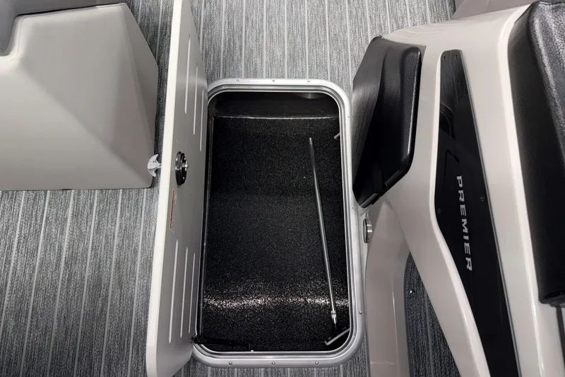 Slide: The Image of Open storage compartment on 2026 Premier 230 Sunsation RL Tritoon boat. - 17