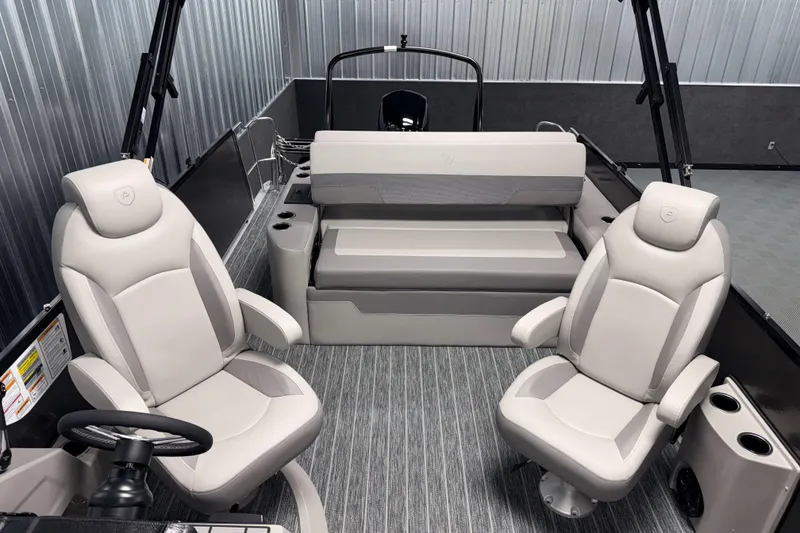 Slide: The Image of 2026 Premier 230 Sunsation RL Tritoon interior with plush seating and modern design. - 18