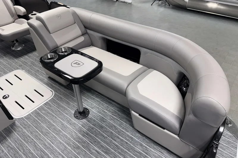 Slide: The Image of Luxurious seating on 2026 Premier 230 Sunsation RL Tritoon with integrated cup holders. - 20