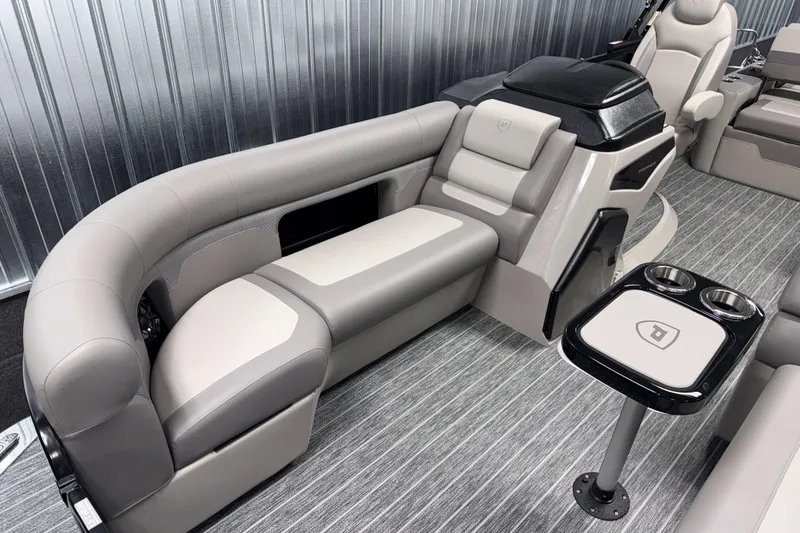 Slide: The Image of 2026 Premier 230 Sunsation RL Tritoon interior with plush seating and modern design. - 21