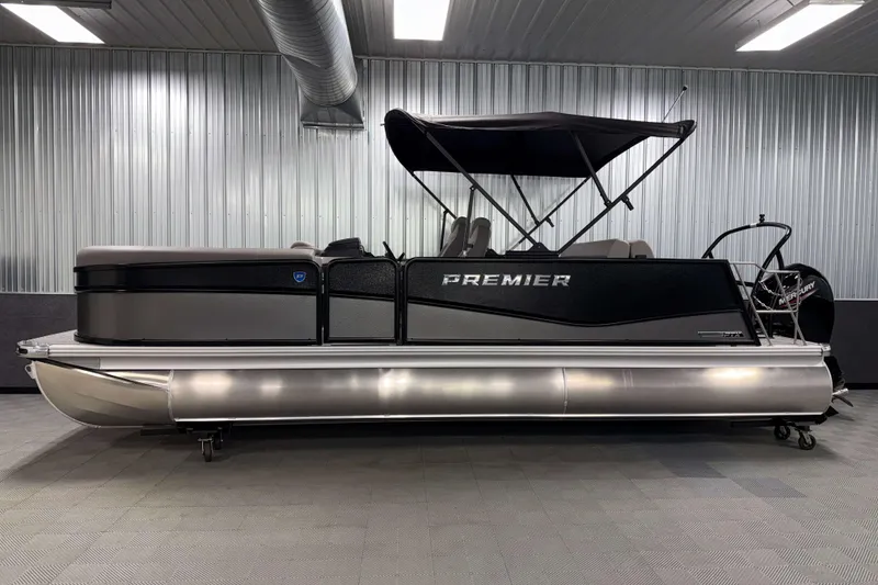 Slide: The Image of 2026 Premier 230 Sunsation RL Tritoon in a modern indoor showroom. - 3