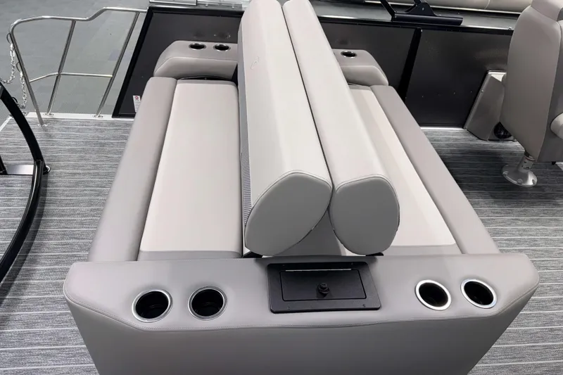 Slide: The Image of Premier 230 Sunsation RL Tritoon 2026 interior seating with cup holders and modern design. - 9