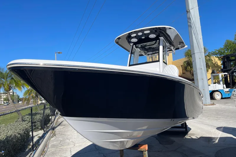 The Image of 2026 Sportsman Masters 227 Bay Boat displayed outdoors on a sunny day. - 0