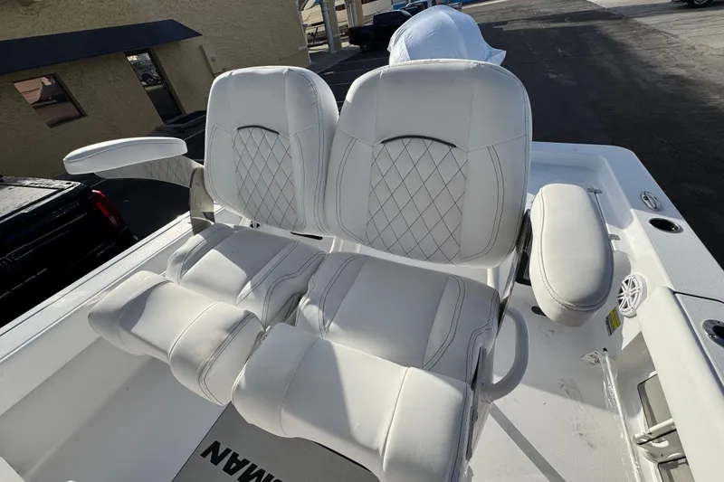 Slide: The Image of 2026 Sportsman Masters 227 Bay Boat with luxurious white seating and armrests. - 13