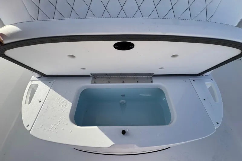 Slide: The Image of Open storage compartment on 2026 Sportsman Masters 227 Bay Boat, featuring a clean interior. - 18