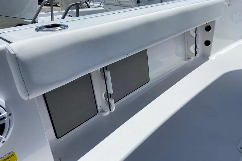 Slide: The Image of 2026 Sportsman Masters 227 Bay Boat interior detail with seating and storage compartments. - 19