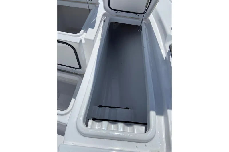 Slide: The Image of Open storage compartment on 2026 Sportsman Masters 227 Bay Boat, showcasing interior space. - 24