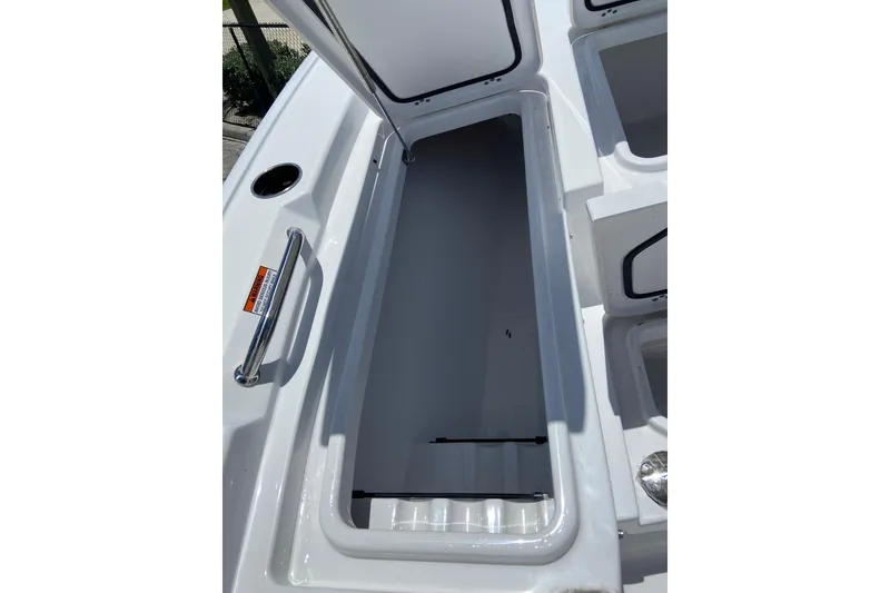Slide: The Image of Open storage compartment on 2026 Sportsman Masters 227 Bay Boat, showcasing spacious interior. - 25