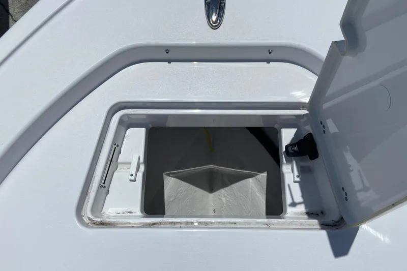 Slide: The Image of Open storage compartment on 2026 Sportsman Masters 227 Bay Boat deck. - 27