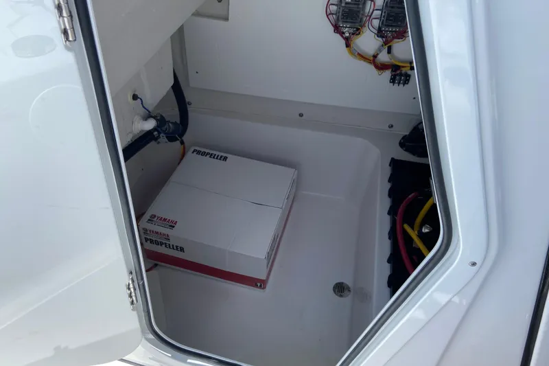 Slide: The Image of Storage compartment of 2026 Sportsman Masters 227 Bay Boat with Yamaha propeller box. - 31
