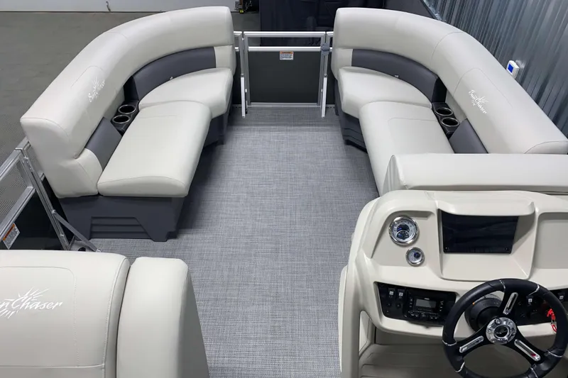 Slide: The Image of Interior of 2026 SunChaser Vista 18 LR pontoon boat with plush seating and modern dashboard. - 10