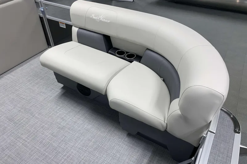 Slide: The Image of 2026 SunChaser Vista 18 LR boat seating with cup holders, featuring elegant gray upholstery. - 11
