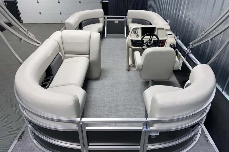 Slide: The Image of 2026 SunChaser Vista 18 LR pontoon boat interior with plush seating and modern helm. - 3