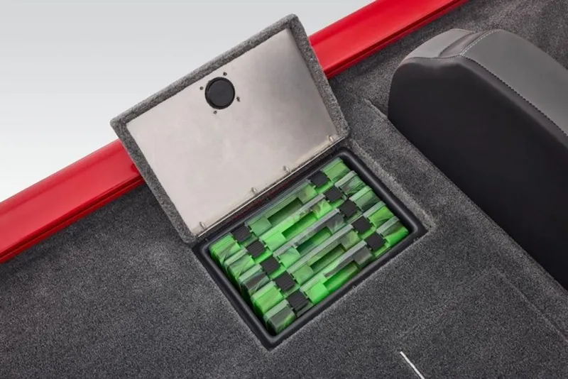 Slide: The Image of 2026 Tracker Pro Team 190 boat storage compartment with organized green tackle boxes. - 9