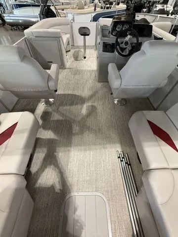 Slide: The Image of 2023 SunCatcher Select 20RC boat interior with plush seating and modern dashboard. - 8