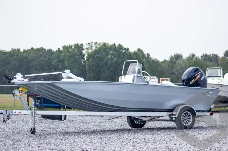 The Image of 2026 G3 Bay 20 boat on trailer, featuring sleek design and powerful outboard motor. - 1