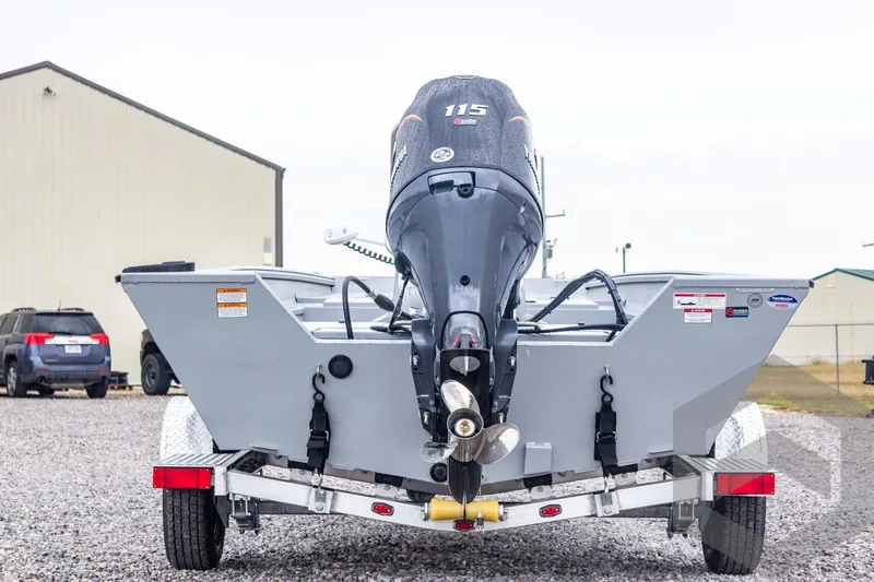 Slide: The Image of 2026 G3 Bay 20 boat with 115 HP motor on trailer, parked outdoors. - 11