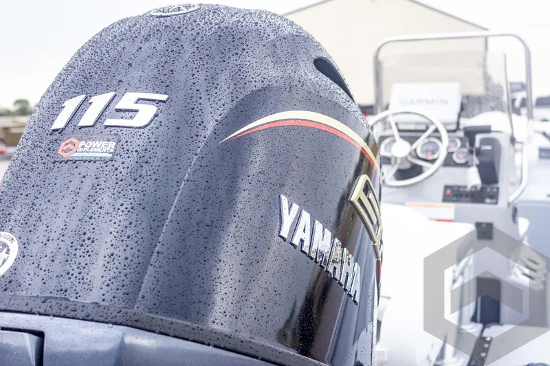 Slide: The Image of Yamaha 115 outboard engine on 2026 G3 Bay 20 boat, with raindrops and Garmin equipment. - 17
