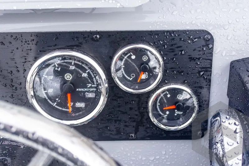 Slide: The Image of Dashboard of 2026 G3 Bay 20 boat with raindrops on gauges. - 33