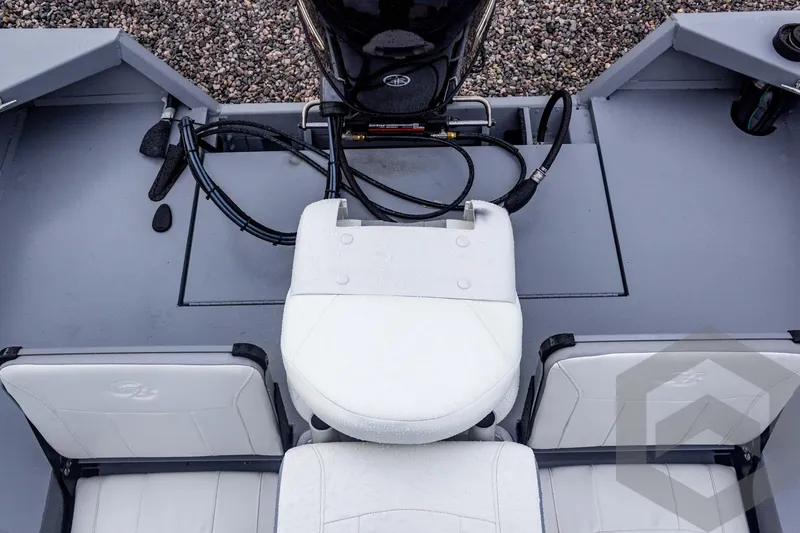 Slide: The Image of 2026 G3 Bay 20 boat interior with white seating and motor cables. - 37