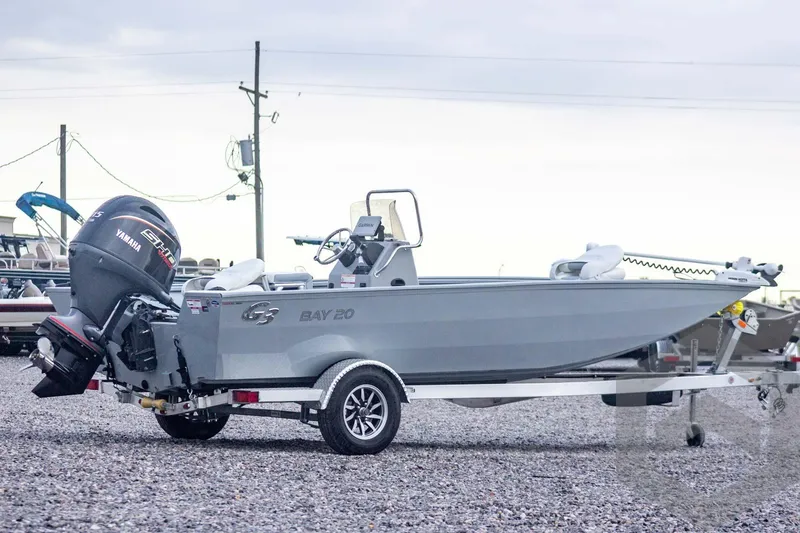 Slide: The Image of 2026 G3 Bay 20 boat with Yamaha outboard motor on a trailer. - 4