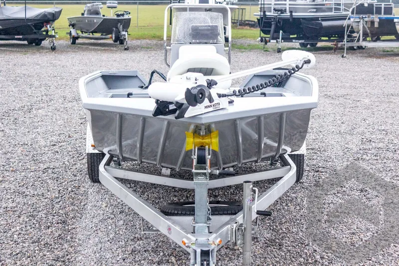 Slide: The Image of 2026 G3 Bay 20 boat on trailer, front view, parked on gravel lot. - 7