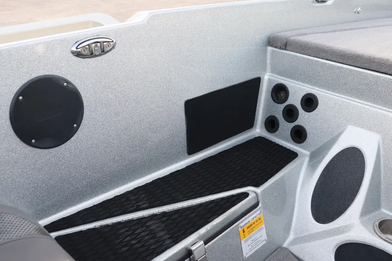 Slide: The Image of 2019 Bass Cat Lynx boat interior with storage compartments and cup holders. - 12