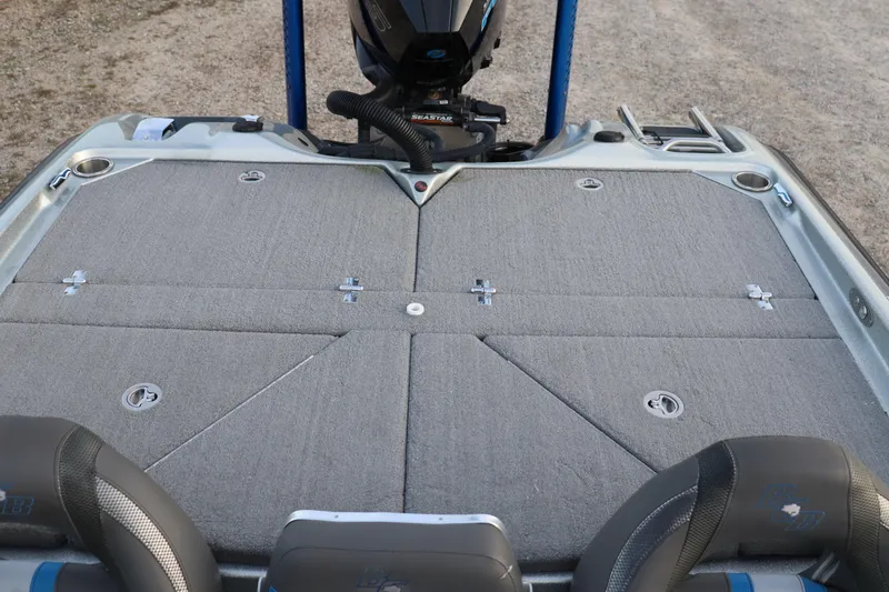 Slide: The Image of 2019 Bass Cat Lynx boat deck with storage compartments and motor. - 13