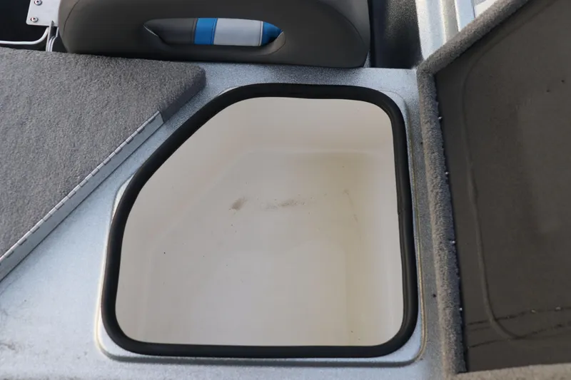 Slide: The Image of 2019 Bass Cat Lynx boat storage compartment with open lid. - 14