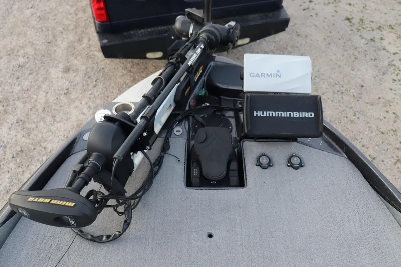 Slide: The Image of 2019 Bass Cat Lynx boat with Garmin and Humminbird electronics, featuring a Minn Kota trolling motor. - 2