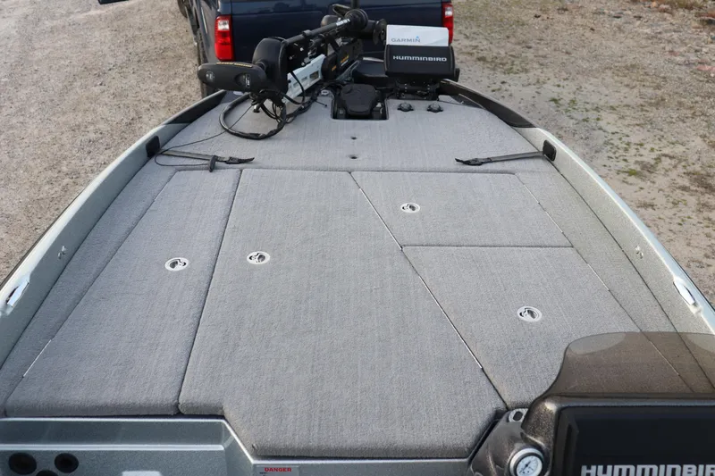 Slide: The Image of 2019 Bass Cat Lynx boat deck with fishing equipment and storage compartments. - 3