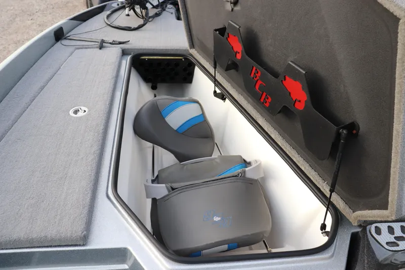 Slide: The Image of 2019 Bass Cat Lynx boat storage compartment with seats and BCB logo. - 5
