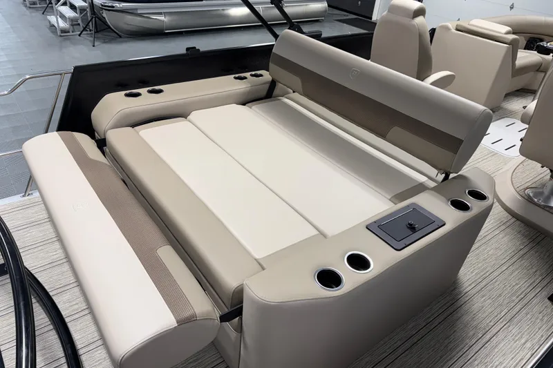 Slide: The Image of 2026 Premier 230 Sunsation RL Tritoon interior with luxurious seating and cup holders. - 11
