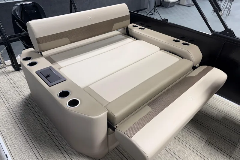 Slide: The Image of Luxurious seating on 2026 Premier 230 Sunsation RL Tritoon with cup holders and sleek design. - 13