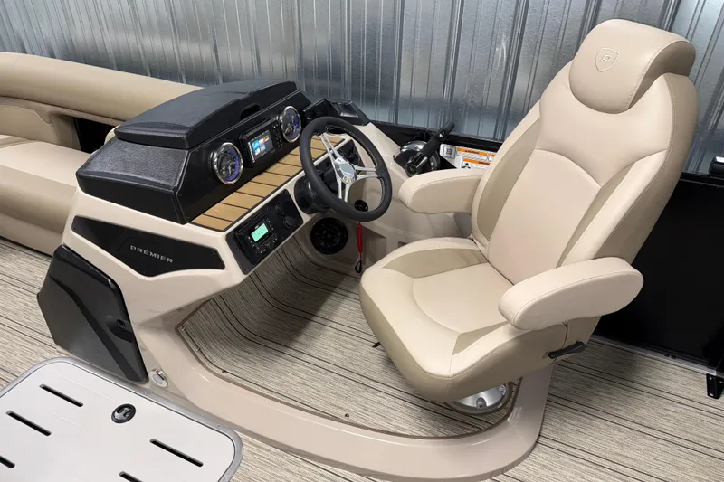 Slide: The Image of Luxurious helm of 2026 Premier 230 Sunsation RL Tritoon with beige captain's chair. - 14