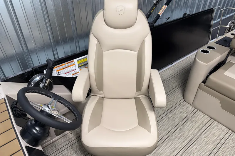 Slide: The Image of Captain's chair and steering wheel of 2026 Premier 230 Sunsation RL Tritoon boat. - 18