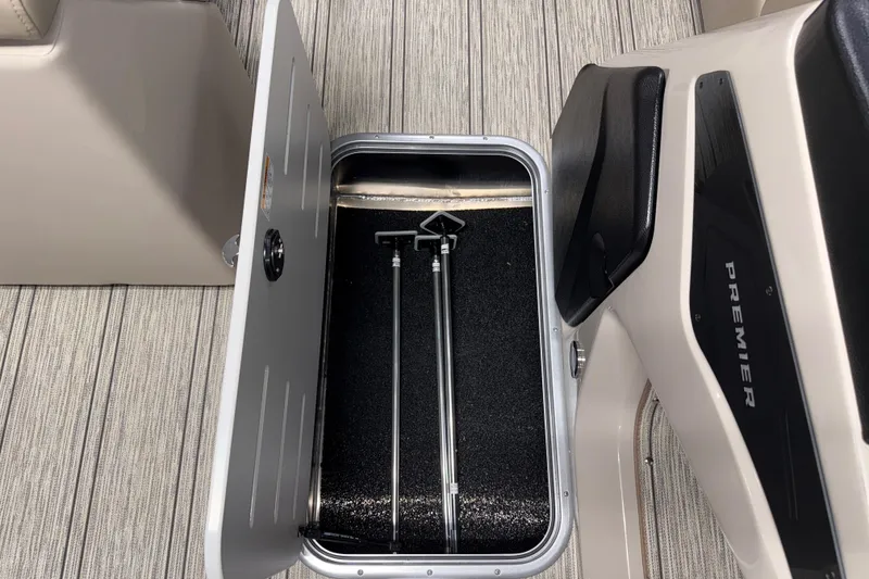 Slide: The Image of Open storage compartment on 2026 Premier 230 Sunsation RL Tritoon boat. - 20