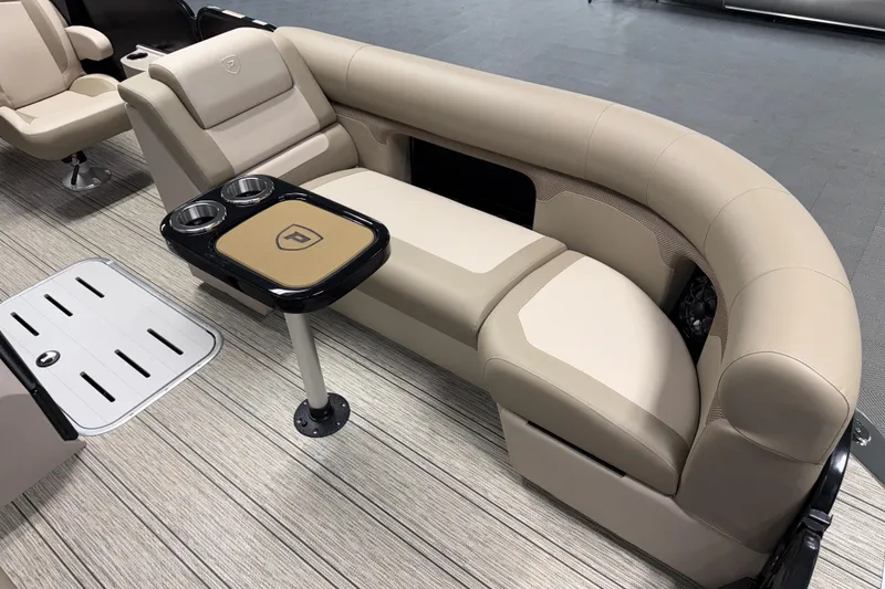 Slide: The Image of Luxurious seating on 2026 Premier 230 Sunsation RL Tritoon with cup holders and sleek design. - 23