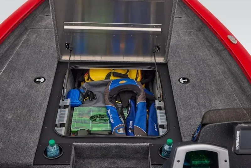 Slide: The Image of 2026 Tracker Pro Team 190 boat storage compartment with fishing gear and life jackets. - 13