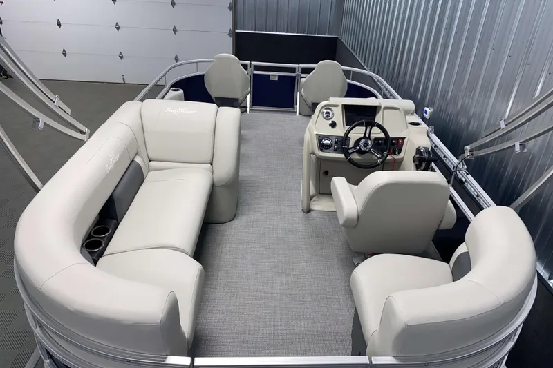 Slide: The Image of 2026 SunChaser Vista 18 Fish pontoon boat interior with plush seating and modern helm. - 2