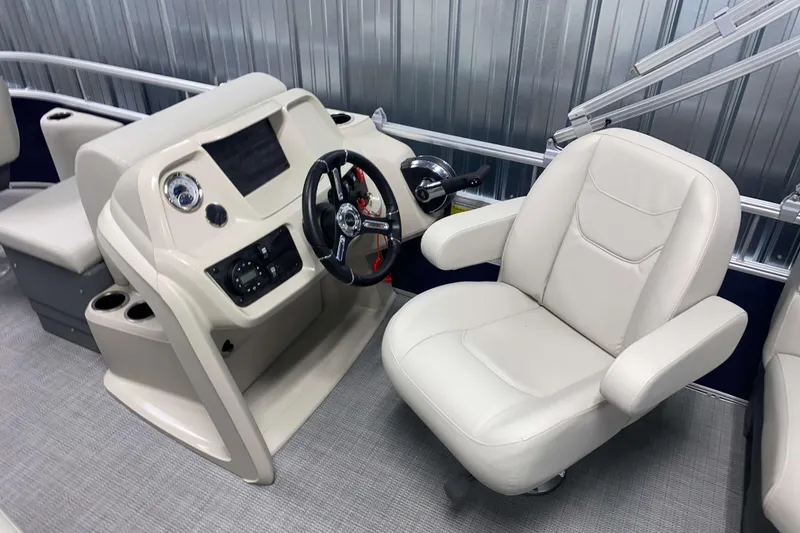 Slide: The Image of 2026 SunChaser Vista 18 Fish boat interior with steering console and captain's chair. - 6
