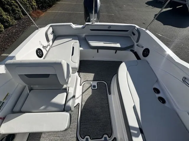 Slide: The Image of 2023 Hurricane SunDeck Sport 205 OB boat interior with spacious seating and modern design. - 11