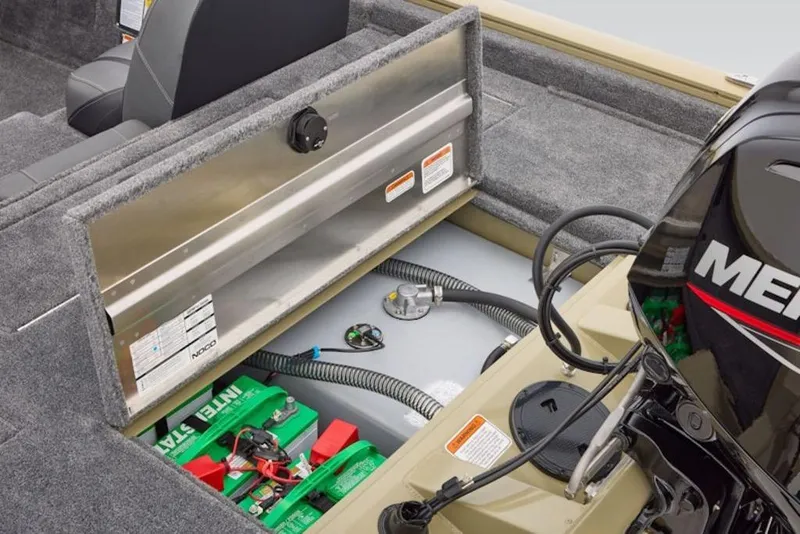 Slide: The Image of 2026 Tracker Pro Team 175 boat interior with open storage compartment and visible engine. - 11