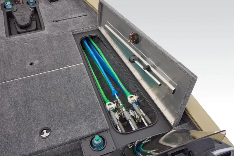 Slide: The Image of 2026 Tracker Pro Team 175 boat storage compartment with organized fishing rods and equipment. - 15