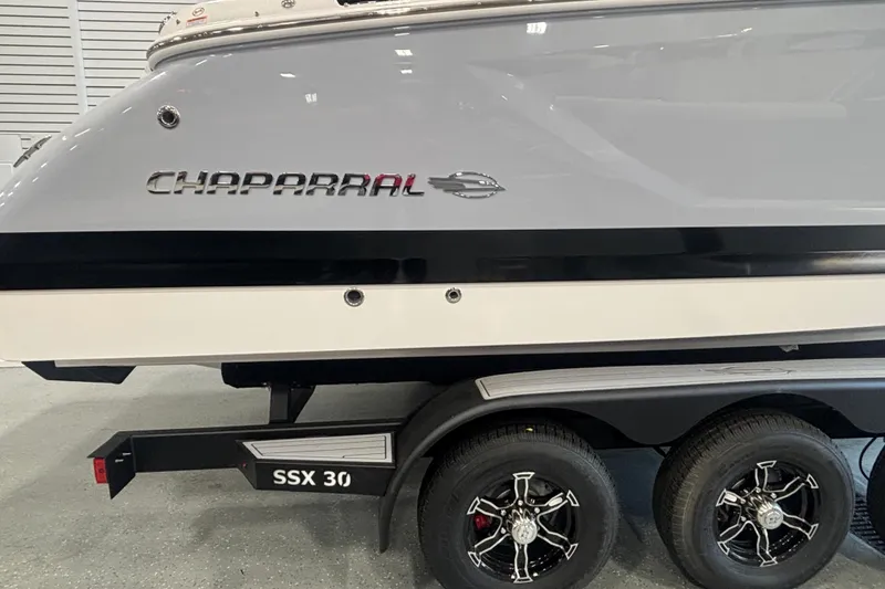 Slide: The Image of 2026 Chaparral SSX 30 boat on trailer, showcasing sleek design and branding. - 2