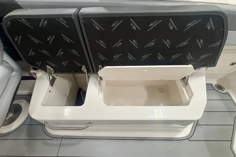 Slide: The Image of 2026 Chaparral SSX 30 boat storage compartments with open seats, showcasing interior design. - 20